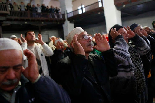 Crimean Tatar Muslims pray in the Great Khan Mosque on the first day of the Eid al-Adha in the city of Bakhchisaray in October 2014